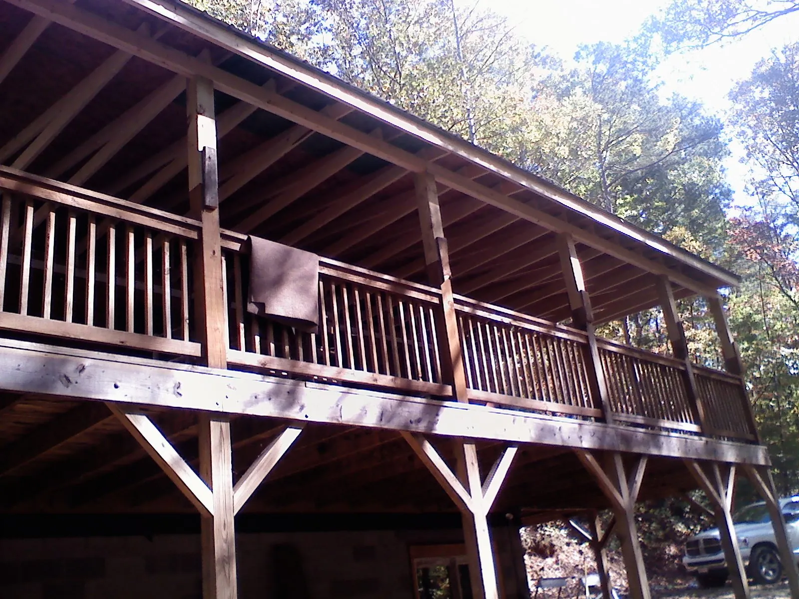 Timber framing under a new elevated porch and deck — Roof Leak Repair in Hooksett by Roofing Brothers